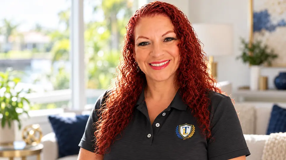 Iris Valentin, owner of women-owned Tax Link Mobile Services, in her Tax Link polo